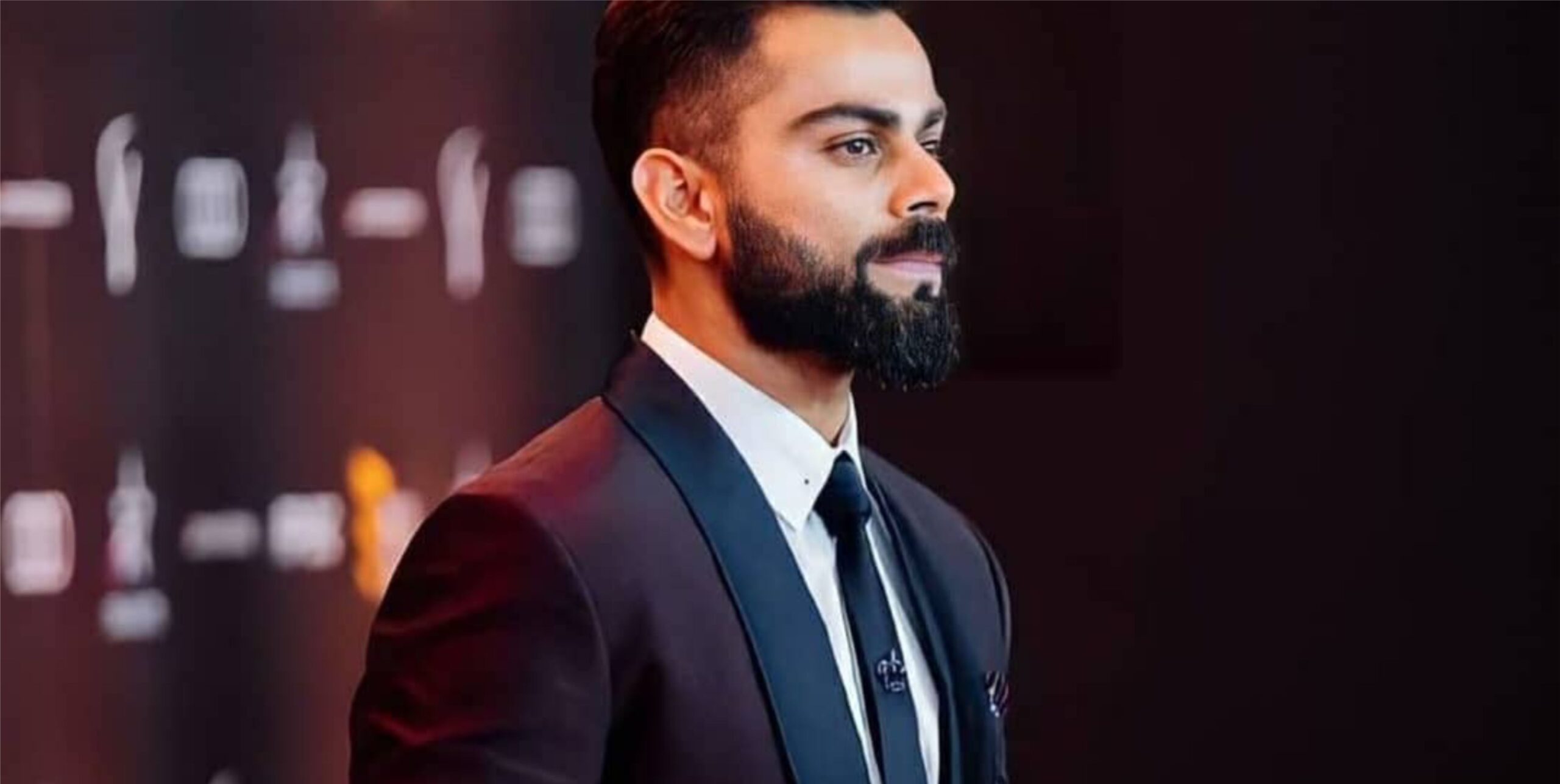 Kohli with black suit
